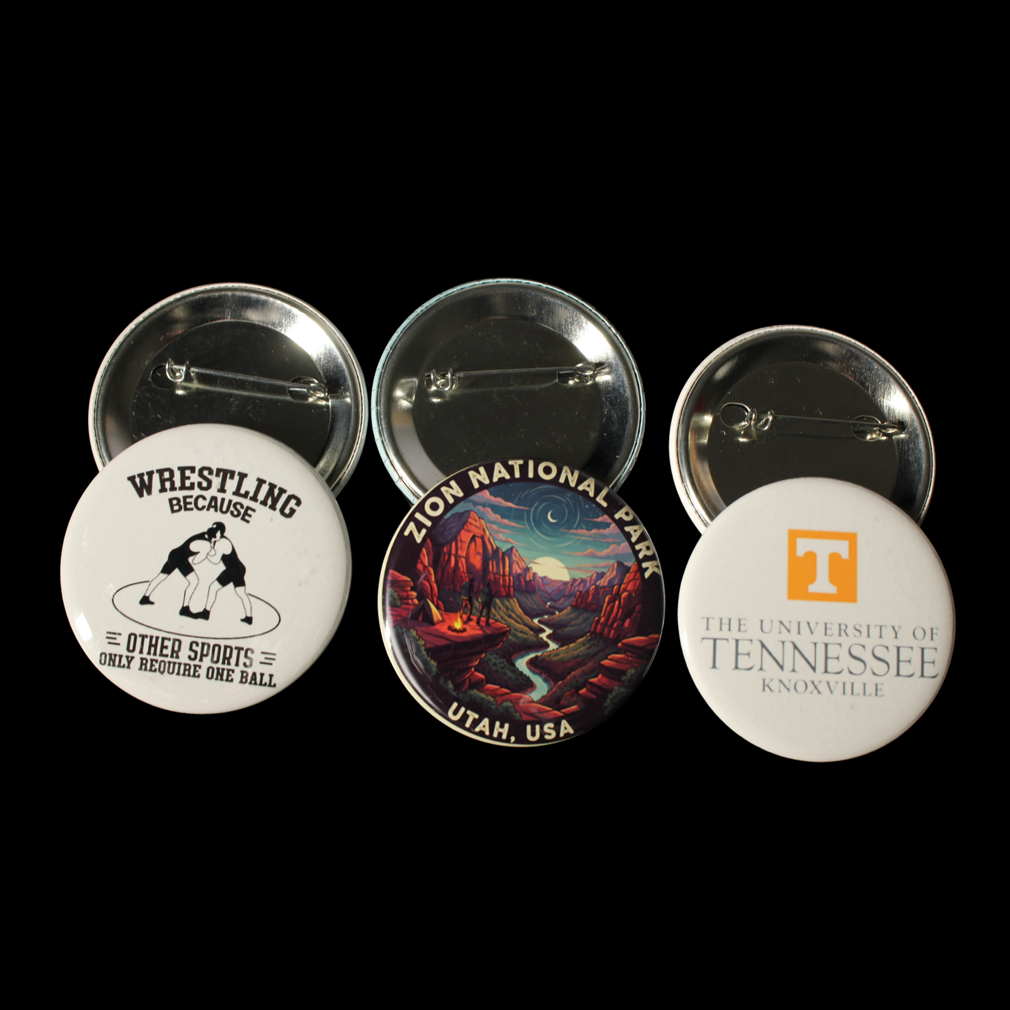 Three buttons featuring different designs on a black background