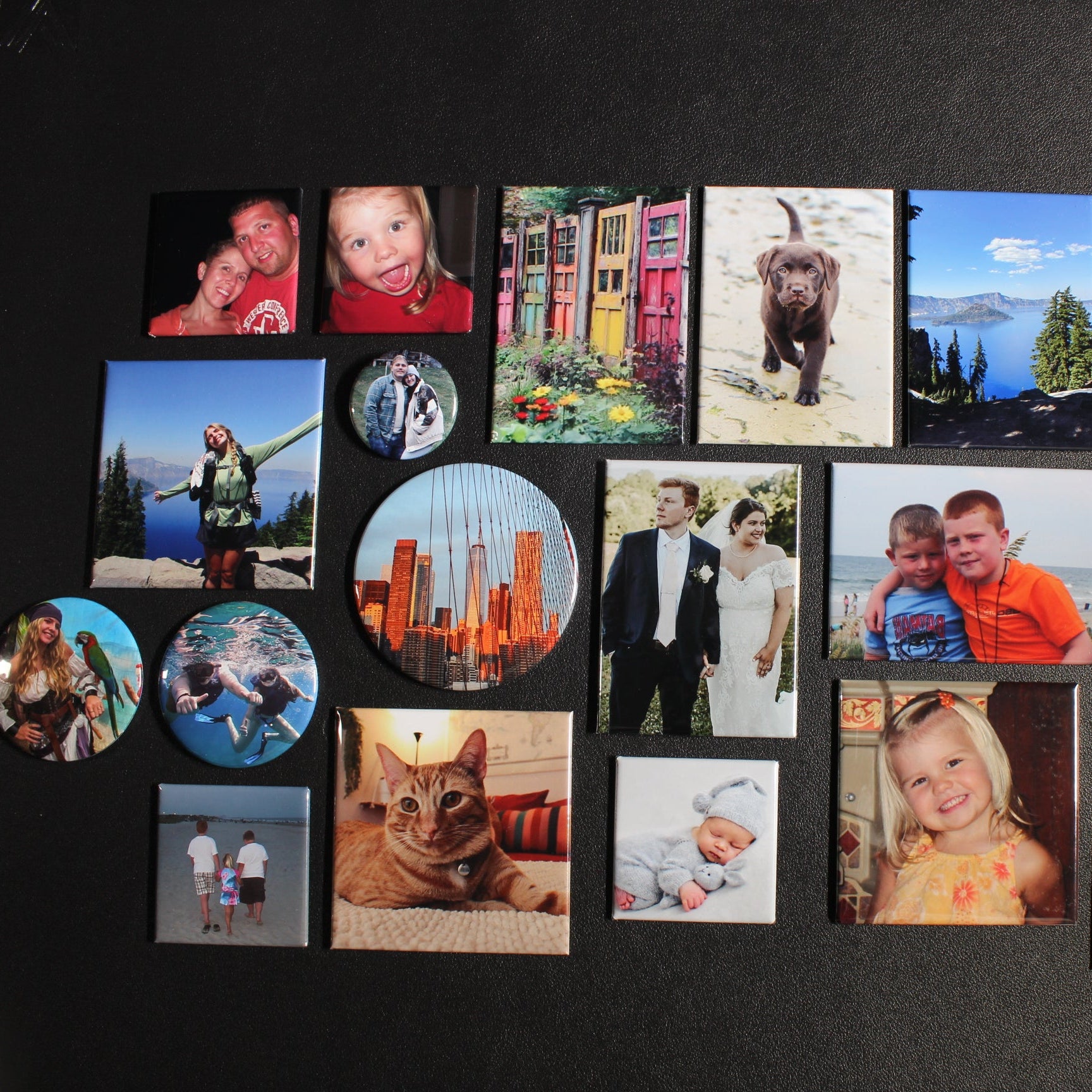 Collection of various custom photo magnets on a dark background
